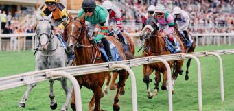 Horse racing jockeys riding