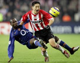 Arsenal defender Lauren with a tough tackle