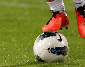 How can spending in football be controlled