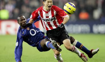 Arsenal defender Lauren with a tough tackle