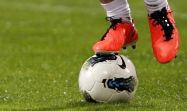 How can spending in football be controlled