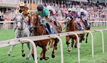 Horse racing jockeys riding